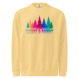 A yellow sweatshirt with a graphic design featuring a line of colorful trees and the text "MERRY & BRIGHT" in a rainbow color scheme.