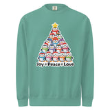 A green sweater with a Christmas tree design made up of various cartoon penguins.